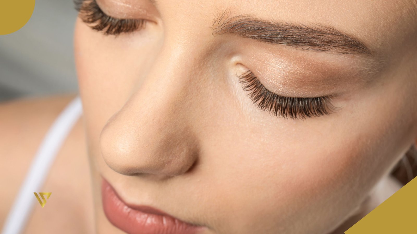 Face of a young woman with dark brown eyebrows, eyes closed, wearing makeup, with a white strap over the shoulder, beauty spa by val, Lash Lift Results Over Time
